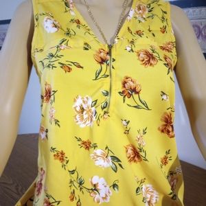 Mileage yellow floral print top. Zip up front, 100 percent polyester. Size: M